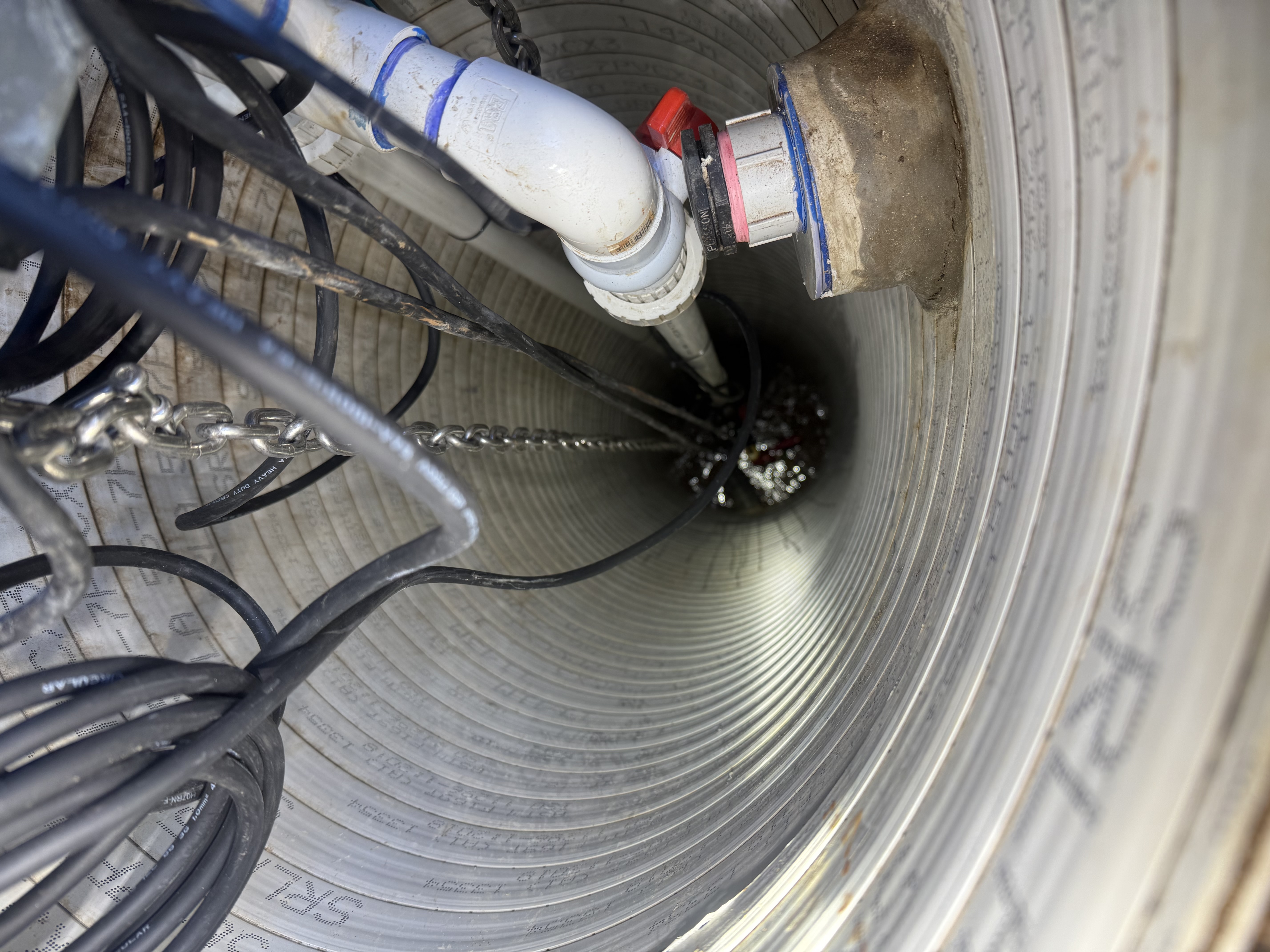Pressure pump installation with PVC pipework and electrical supply on a Burnside residential property