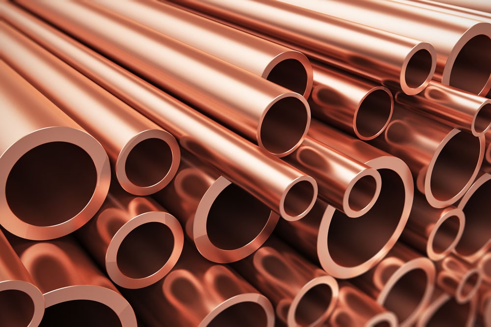 a stack of copper pipes