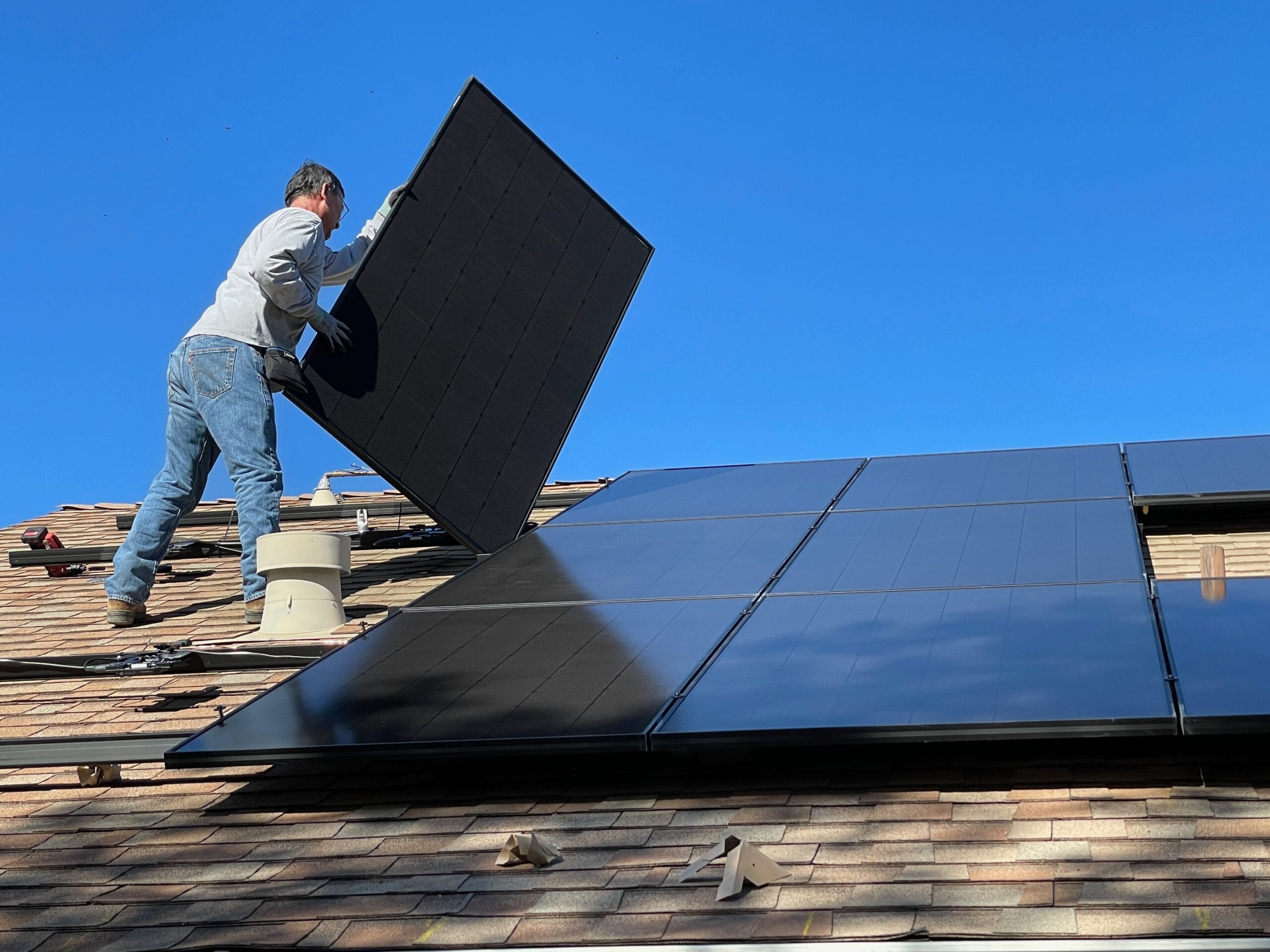 a man installing solar panels